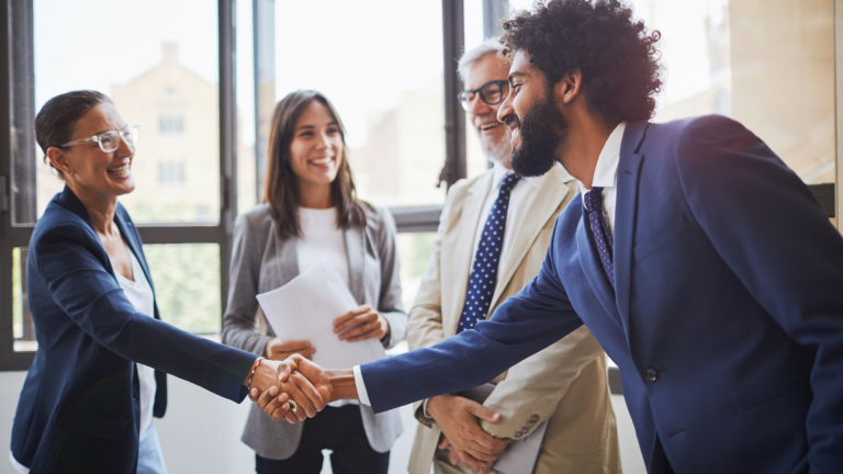 Appropriate Mailing Equipment - business people shaking hands